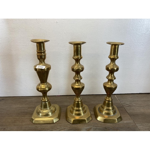 335 - A collection of copper and brassware to include a pair of 25cm brass candlesticks, brass table lamp,... 