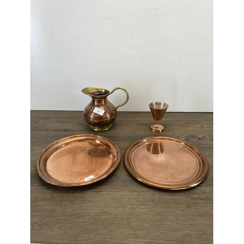 335 - A collection of copper and brassware to include a pair of 25cm brass candlesticks, brass table lamp,... 