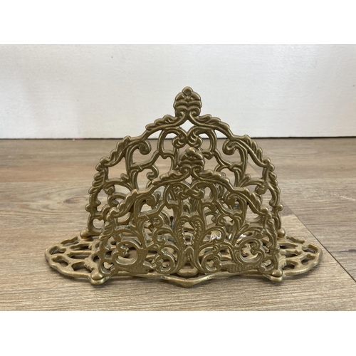 340 - Eight pieces of metalware to include 19th century style brass letter rack, 19th century copper kettl... 