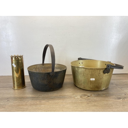 352 - Three pieces of brassware, two 19th century brass preserve pans - largest approx. 16cm high x 31.5cm... 