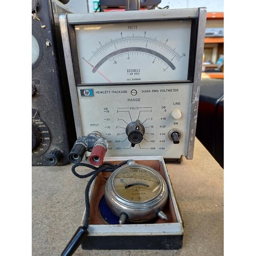 704 - Four items, one Hewlett-Packard voltmeter, two AVO Ltd. AVOmeter multimeters and one boxed pocket vo... 