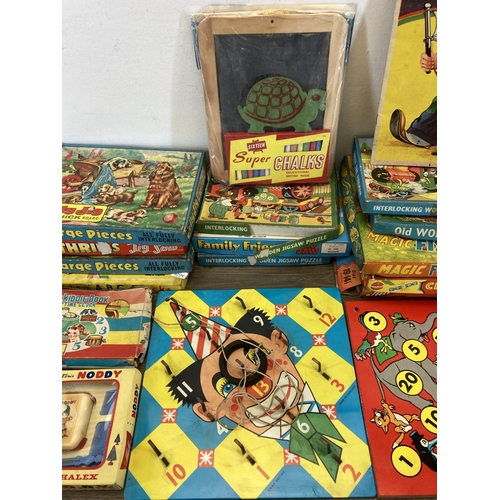 369 - A collection of mid 20th century jigsaw puzzles to include Thrills, Jolly Jig, Junior treasure etc.