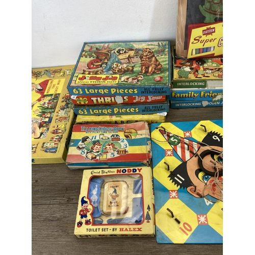 369 - A collection of mid 20th century jigsaw puzzles to include Thrills, Jolly Jig, Junior treasure etc.