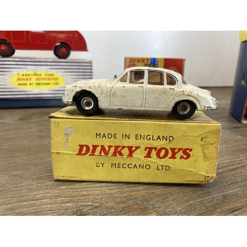 381 - Ten mid 20th century boxed Dinky diecast model vehicles, U.S.A. Police Car - no. 258, M.G.B. Sports ... 