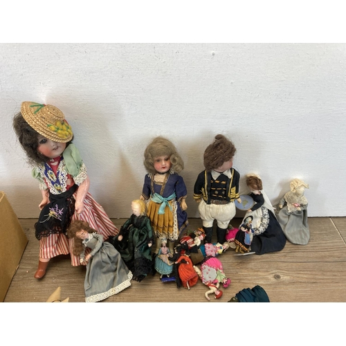 391 - A collection of vintage handmade dolls and accessories