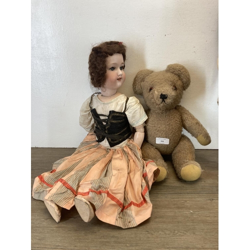 392 - Four items, mid 20th century articulated teddy bear, Cellose no. 2 hand painted doll, Pedigree doll ... 