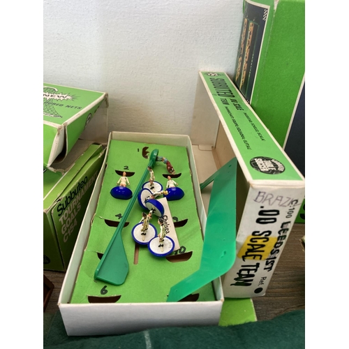 395 - A collection of vintage Subbuteo accessories to include Tournament Goals - no. C154, Work Cup Goals,... 