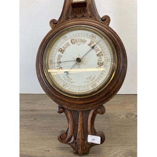 581 - A 19th century carved oak aneroid barometer - approx. 88cm high