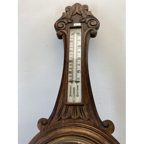 581 - A 19th century carved oak aneroid barometer - approx. 88cm high