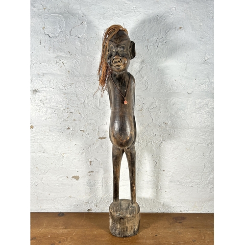 583 - A Maori carved hardwood statue - approx. 98cm high