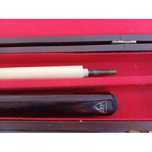 587 - A cased BCE Alex Higgins signature two-piece snooker cue