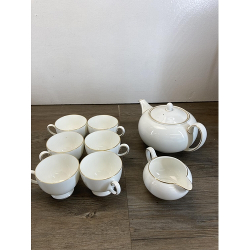 275 - A collection of Wedgwood white and gold rimmed bone china to include six teacups, teapot, milk jug, ... 