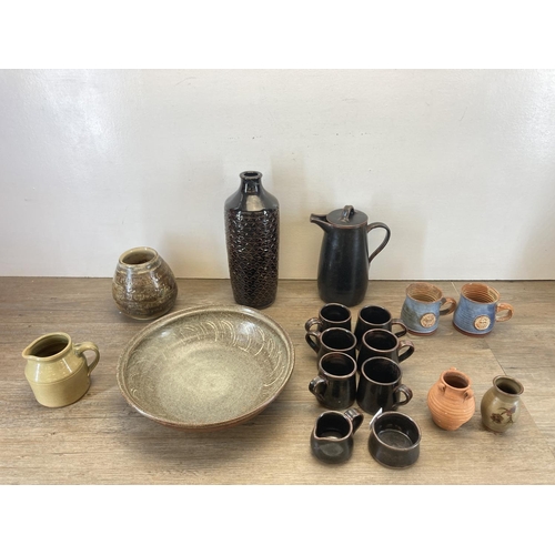 284 - A collection of studio pottery to include nine piece coffee set, Robert Lowe handthrown stoneware ci... 