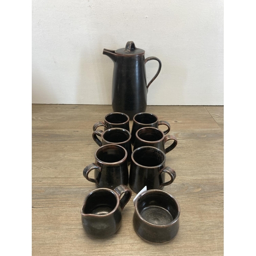 284 - A collection of studio pottery to include nine piece coffee set, Robert Lowe handthrown stoneware ci... 