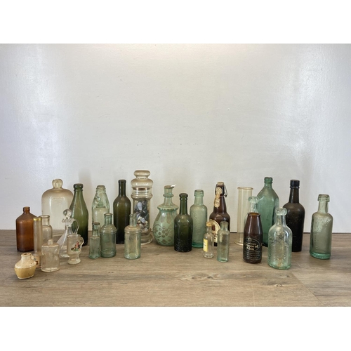 300 - A collection of antique and vintage glass bottles