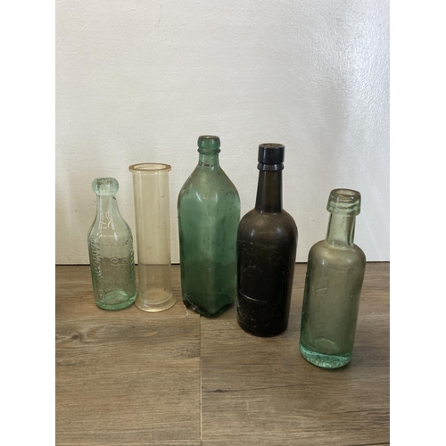 300 - A collection of antique and vintage glass bottles