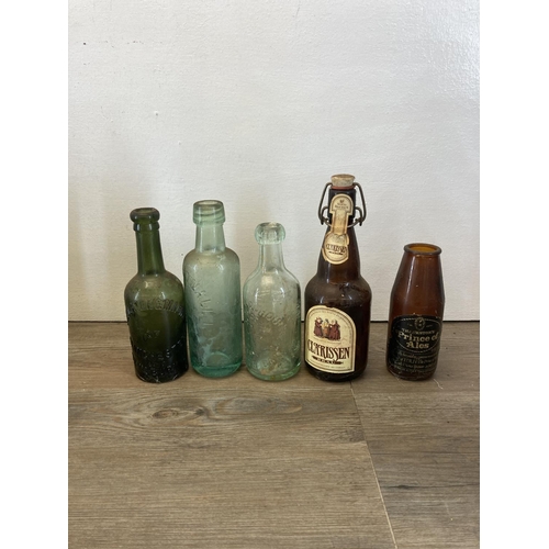 300 - A collection of antique and vintage glass bottles