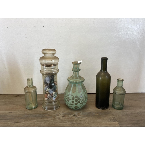 300 - A collection of antique and vintage glass bottles