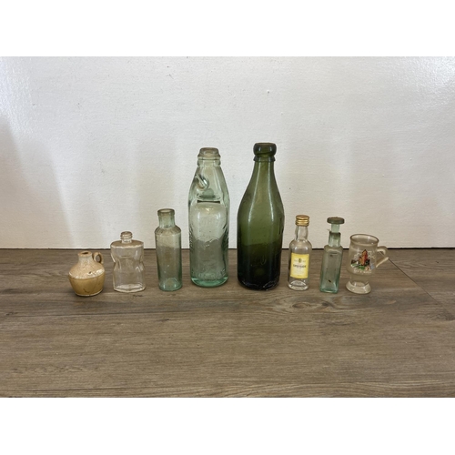 300 - A collection of antique and vintage glass bottles