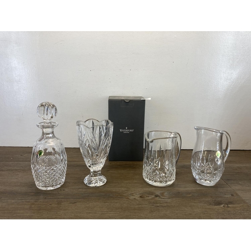 306 - Four pieces of Waterford Crystal glassware to include boxed Colleen spirit decanter etc.