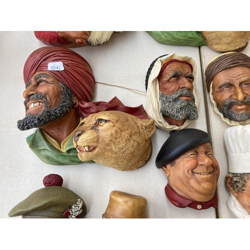 317A - Twenty three Bossons and Naturecraft hand painted chalkware wall masks to include Deccan Hunters, Jo... 