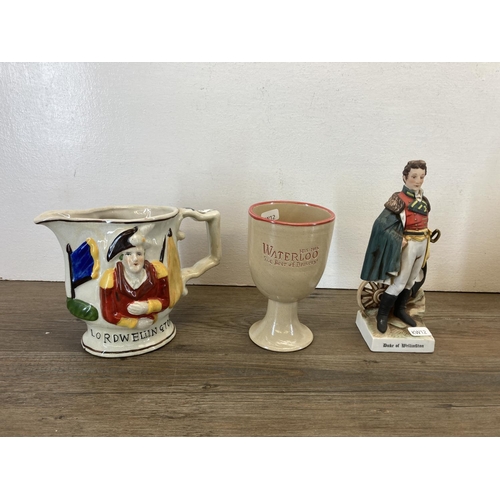 321 - A collection of items to include Lord Wellington ceramic jug, Waterloo The Beer of Bravery goblet, t... 