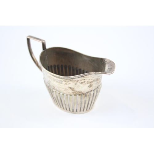 2293 - A William Devenport hallmarked Birmingham sterling silver cream jug, dated 1903 - approx. 6.6cm high... 