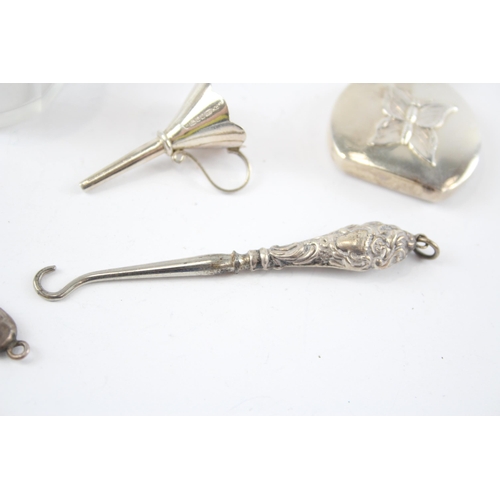 2296 - Five hallmarked sterling silver vanity items to include scent bottle with butterfly design, button h... 