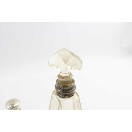 2297 - Eight .925 silver topped glass vanity bottles