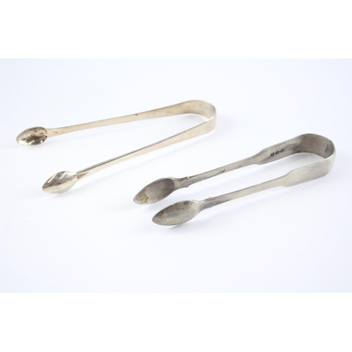 2304 - Two pairs of antique hallmarked sterling silver sugar tongs - approx. gross weight 75g