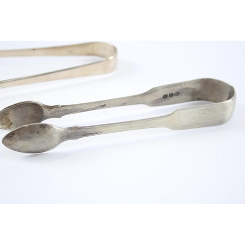 2304 - Two pairs of antique hallmarked sterling silver sugar tongs - approx. gross weight 75g