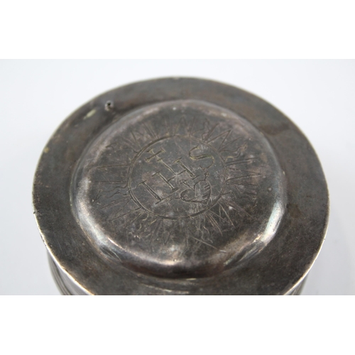 2308 - An antique .950 silver engraved trinket box - approx. 6.1cm diameter and 65g