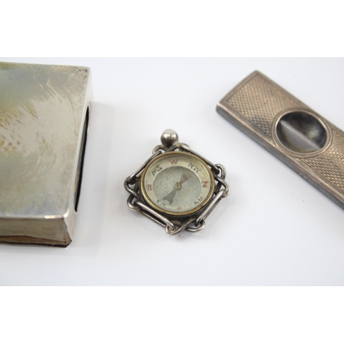 2313 - Three pieces of hallmarked sterling silver, one cigar cutter, one match holder and one compass - app... 