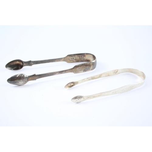 2318 - Two pairs of Georgian hallmarked sterling silver sugar tongs - approx. gross weight 93g