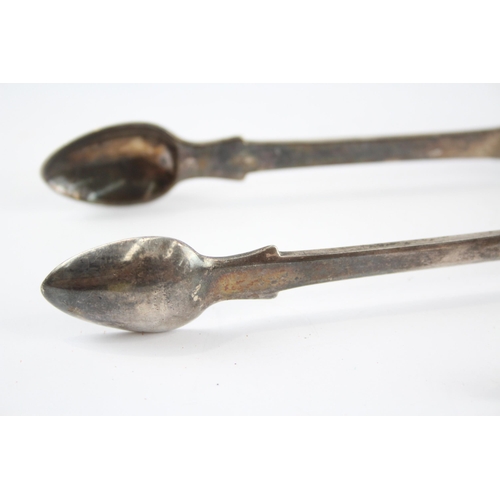 2318 - Two pairs of Georgian hallmarked sterling silver sugar tongs - approx. gross weight 93g