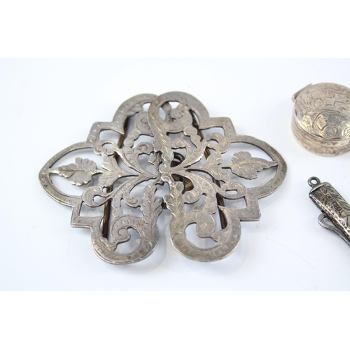 2321 - Four antique hallmarked sterling silver items to include foliate etched pill box, belt buckle etc. -... 