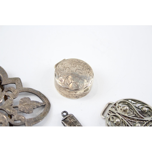 2321 - Four antique hallmarked sterling silver items to include foliate etched pill box, belt buckle etc. -... 