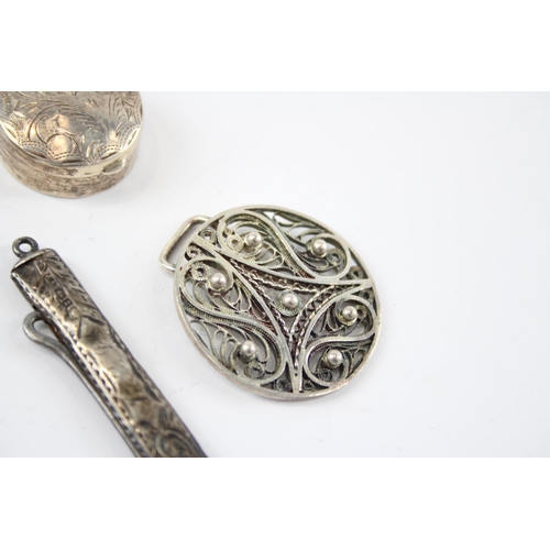 2321 - Four antique hallmarked sterling silver items to include foliate etched pill box, belt buckle etc. -... 