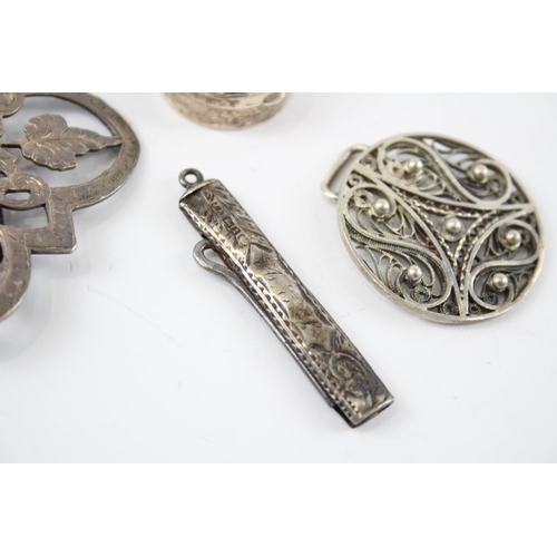 2321 - Four antique hallmarked sterling silver items to include foliate etched pill box, belt buckle etc. -... 