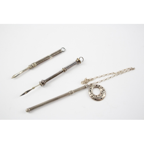 2324 - Three hallmarked sterling silver items, two toothpicks and one swizzle stick - approx. gross weight ... 