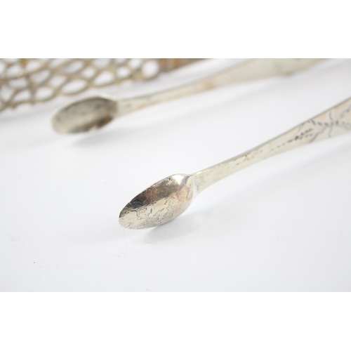 2336 - Two pairs of antique hallmarked sterling silver sugar tongs - approx. gross weight 65g