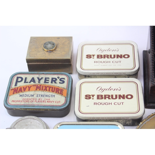 323 - A collection of tobacciana to include tobacco tins, ashtrays etc.