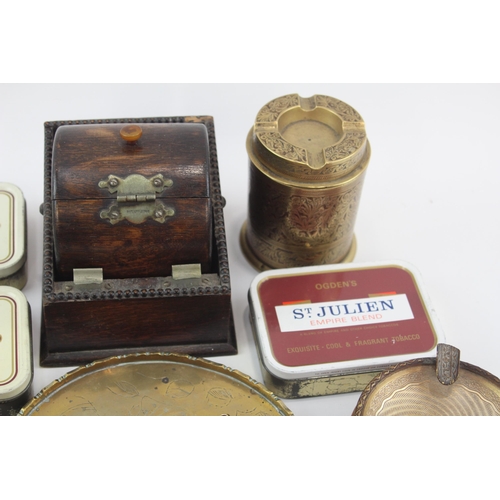 323 - A collection of tobacciana to include tobacco tins, ashtrays etc.