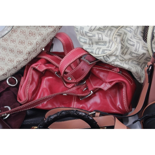 420 - A collection of women's handbags and purses