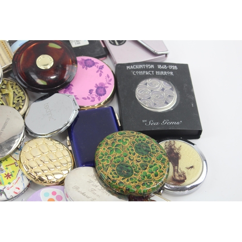 481 - A large collection of women's mirrors and compacts