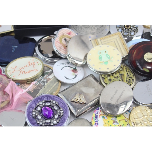 481 - A large collection of women's mirrors and compacts