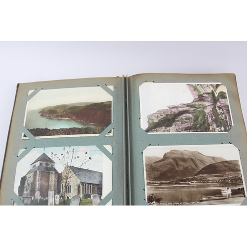 519 - A vintage postcard album containing a large collection of postcards