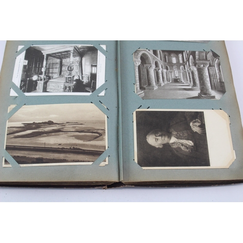 519 - A vintage postcard album containing a large collection of postcards