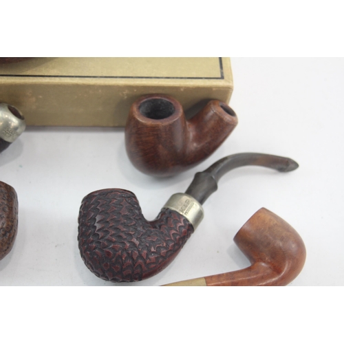 526 - Seven vintage smoking pipes and bowls to include K & P Peterson's etc.