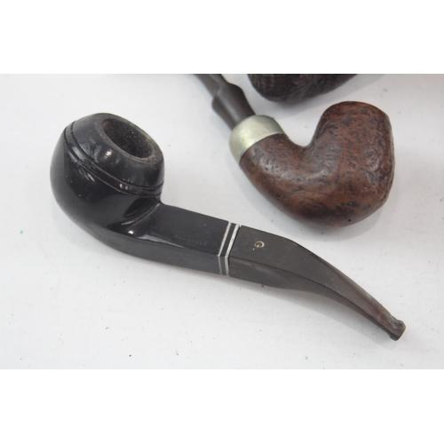 526 - Seven vintage smoking pipes and bowls to include K & P Peterson's etc.